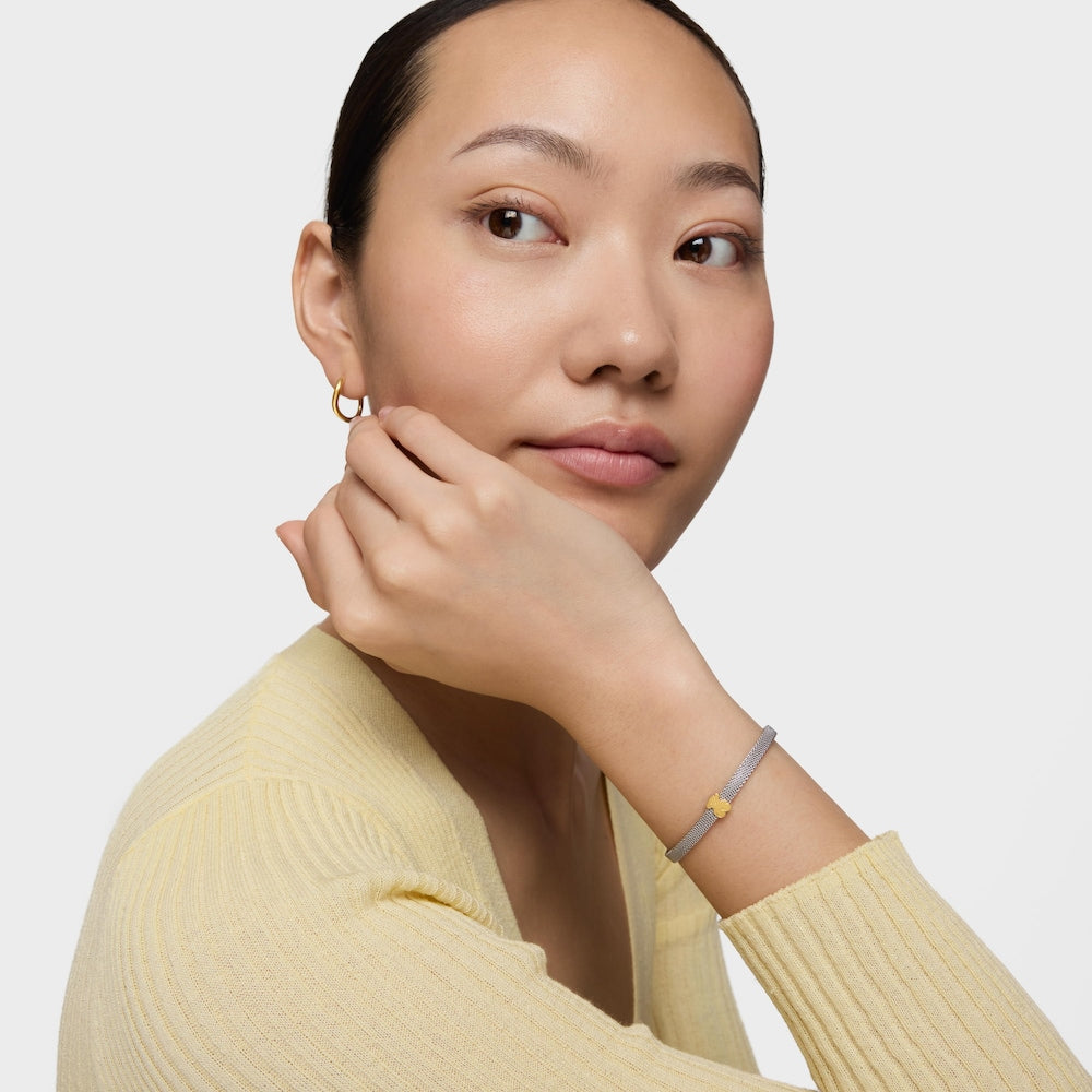 Pulsera de malla con icono de acero y oro